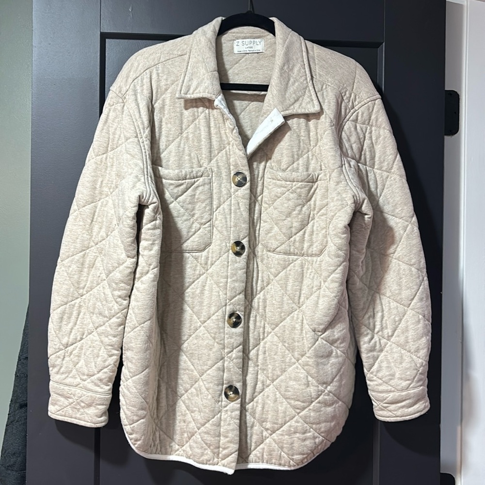 Taupe/nude quilted jacket.